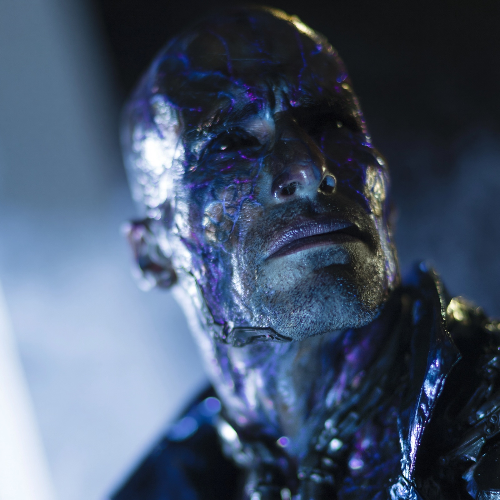 Chrome and violet cybernetic face close-up