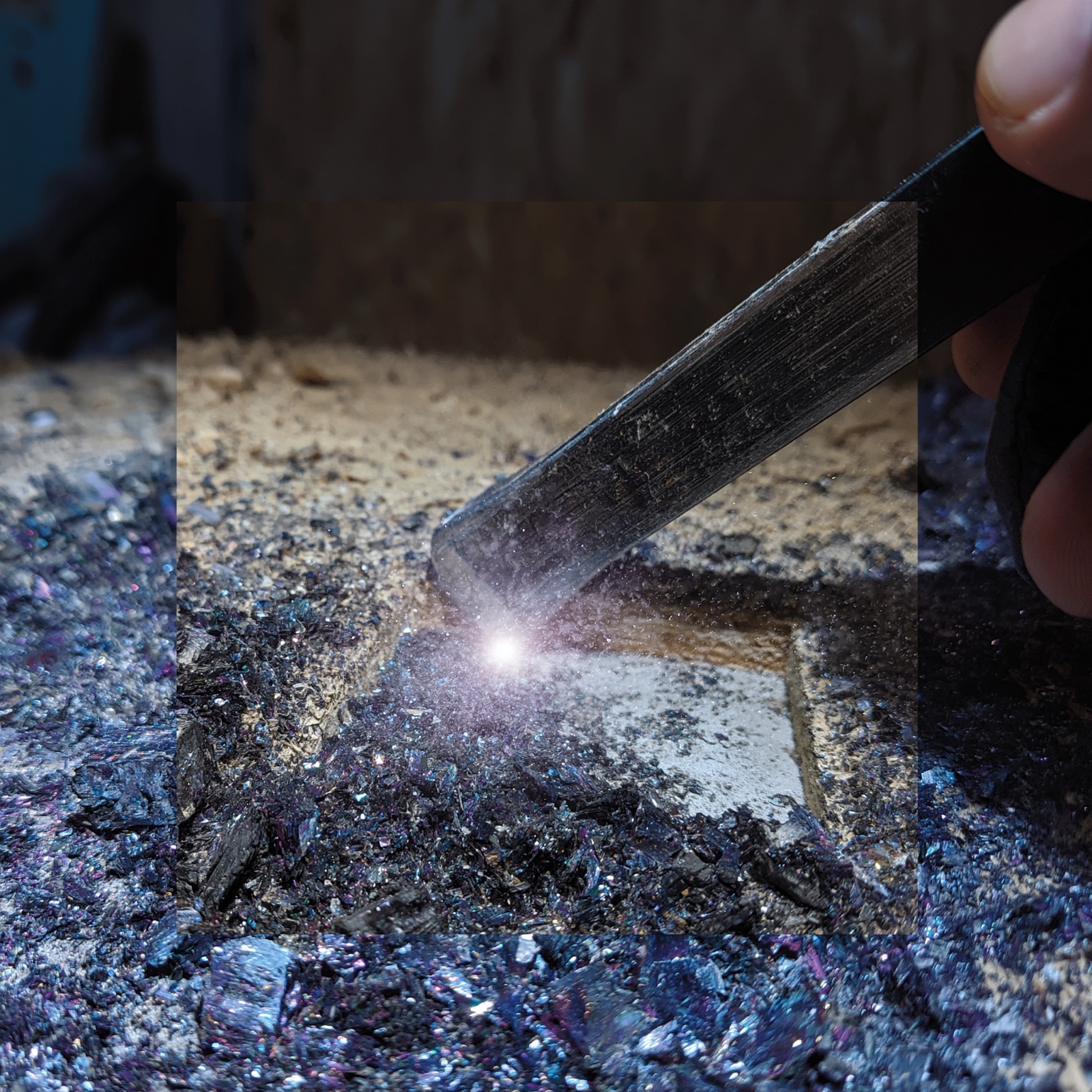 Tool scraping glowing crystalline dust from a surface